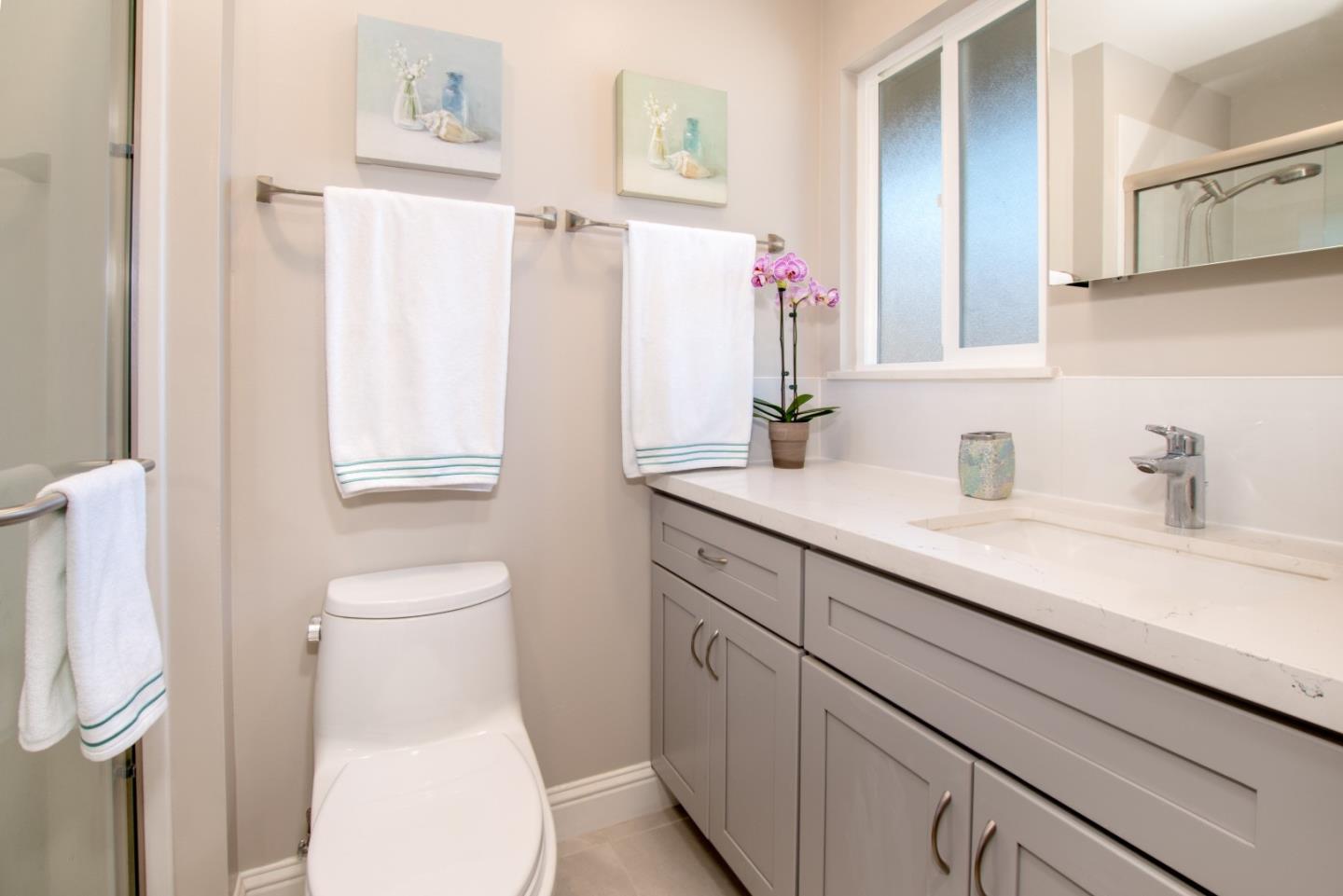 3416 Tracy Drive Santa Clara, CA 95051 - Photo 15 of 26 a bathroom with a toilet sink and mirror