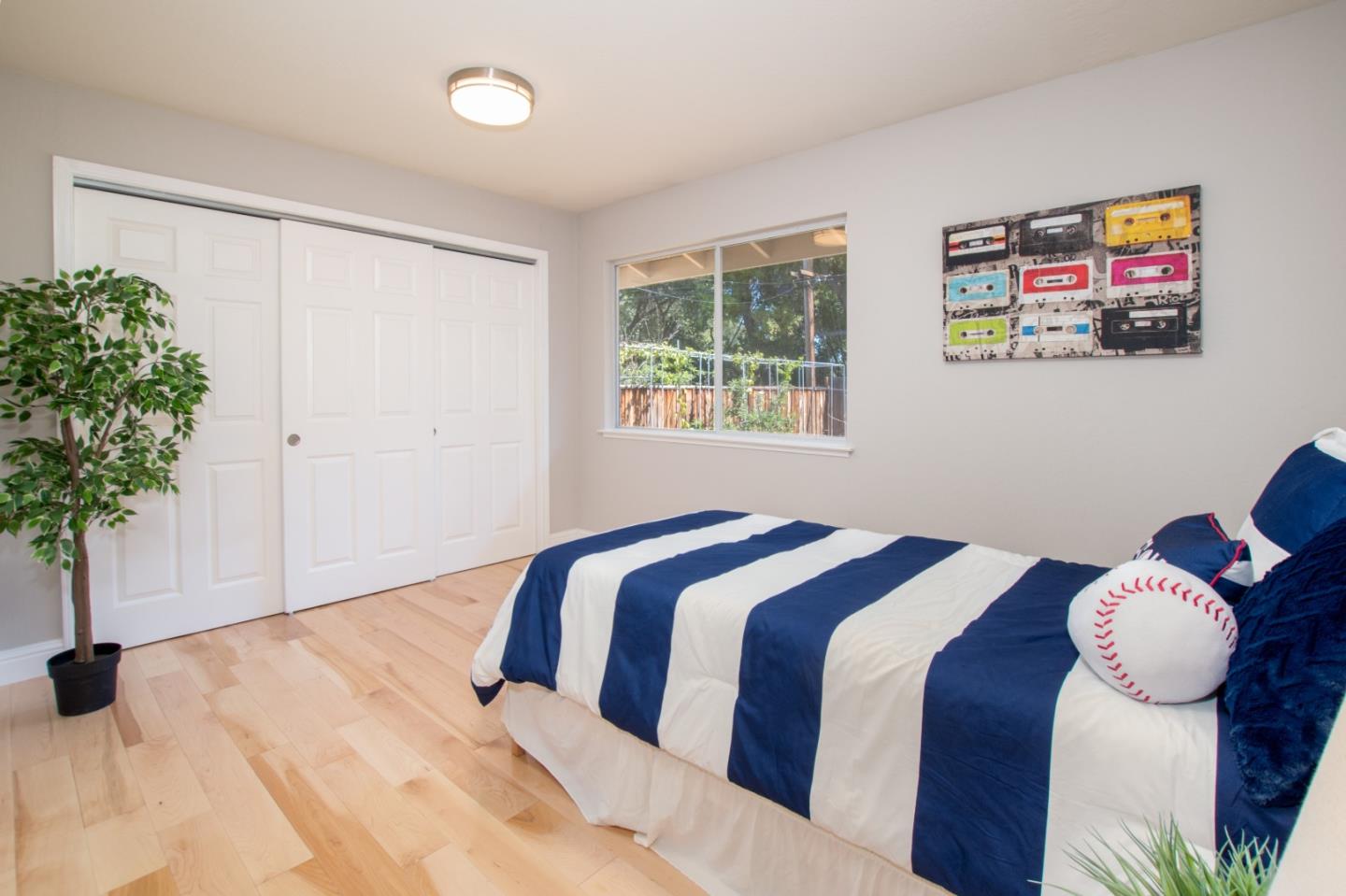 3416 Tracy Drive Santa Clara, CA 95051 - Photo 16 of 26 a bedroom with a bed and a potted plant