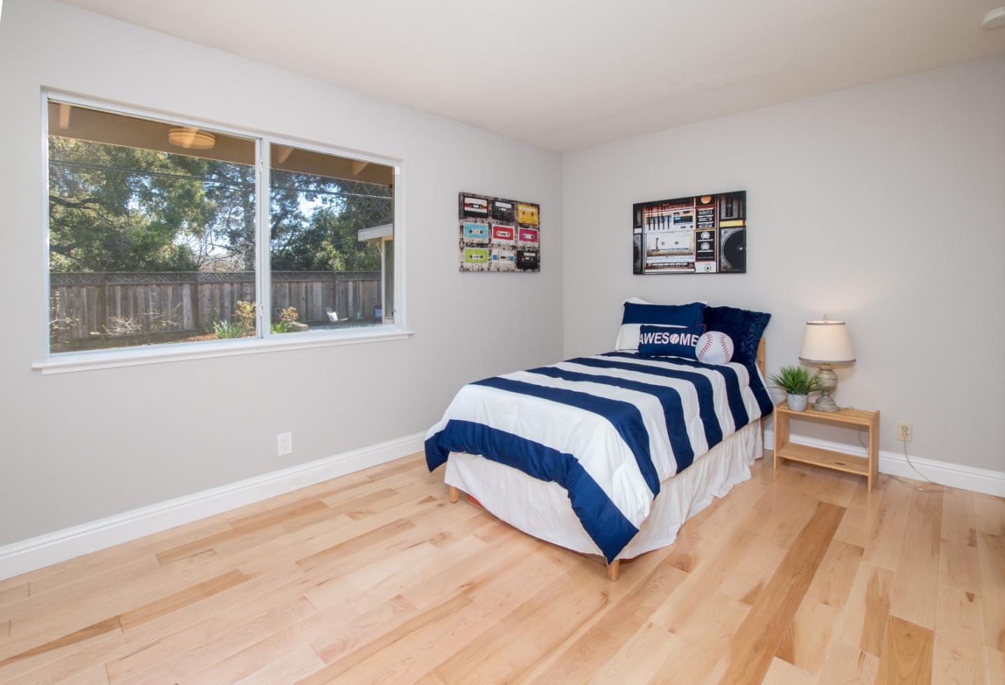 3416 Tracy Drive Santa Clara, CA 95051 - Photo 17 of 26 a bedroom with a bed and glass window