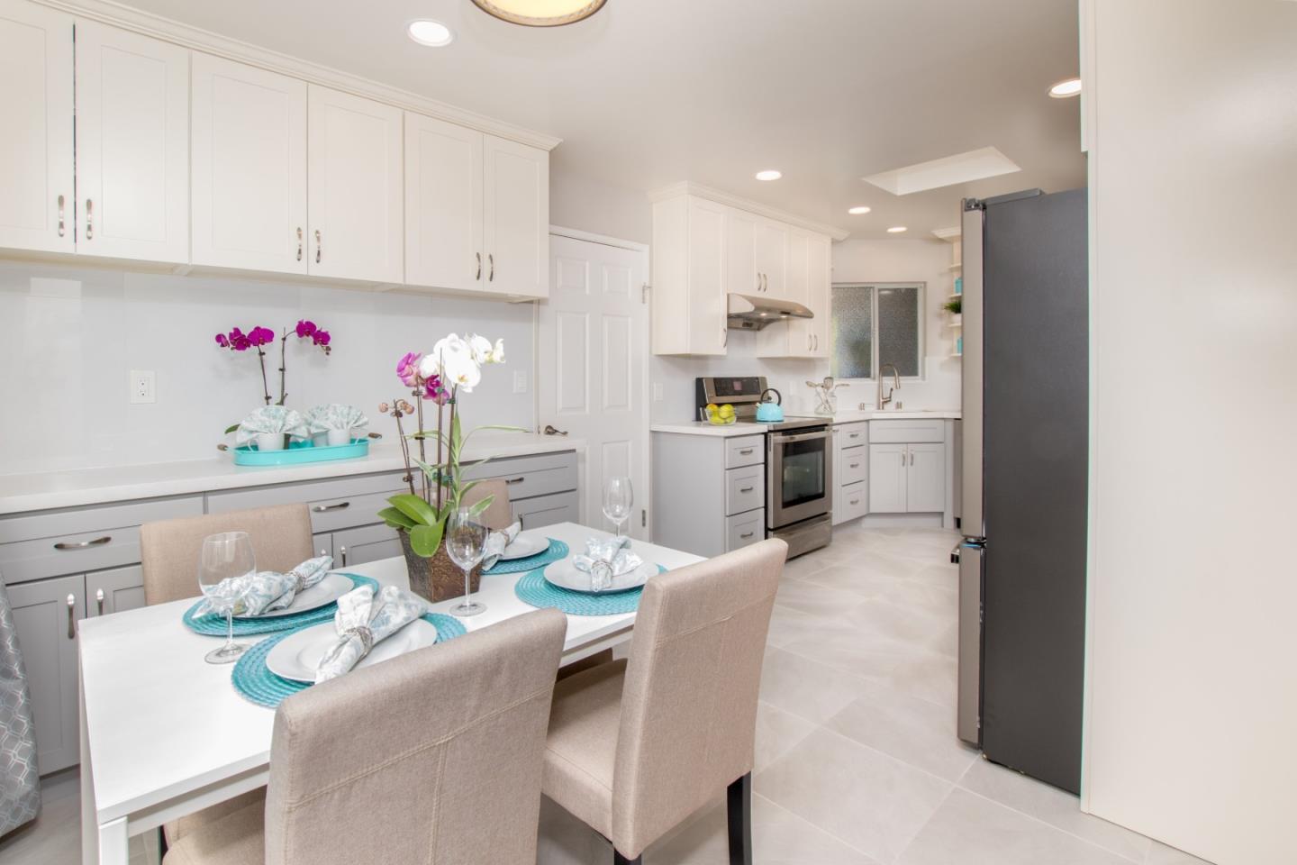 3416 Tracy Drive Santa Clara, CA 95051 - Photo 7 of 26 a room with stainless steel appliances kitchen island granite countertop a stove a sink a dining table and chairs