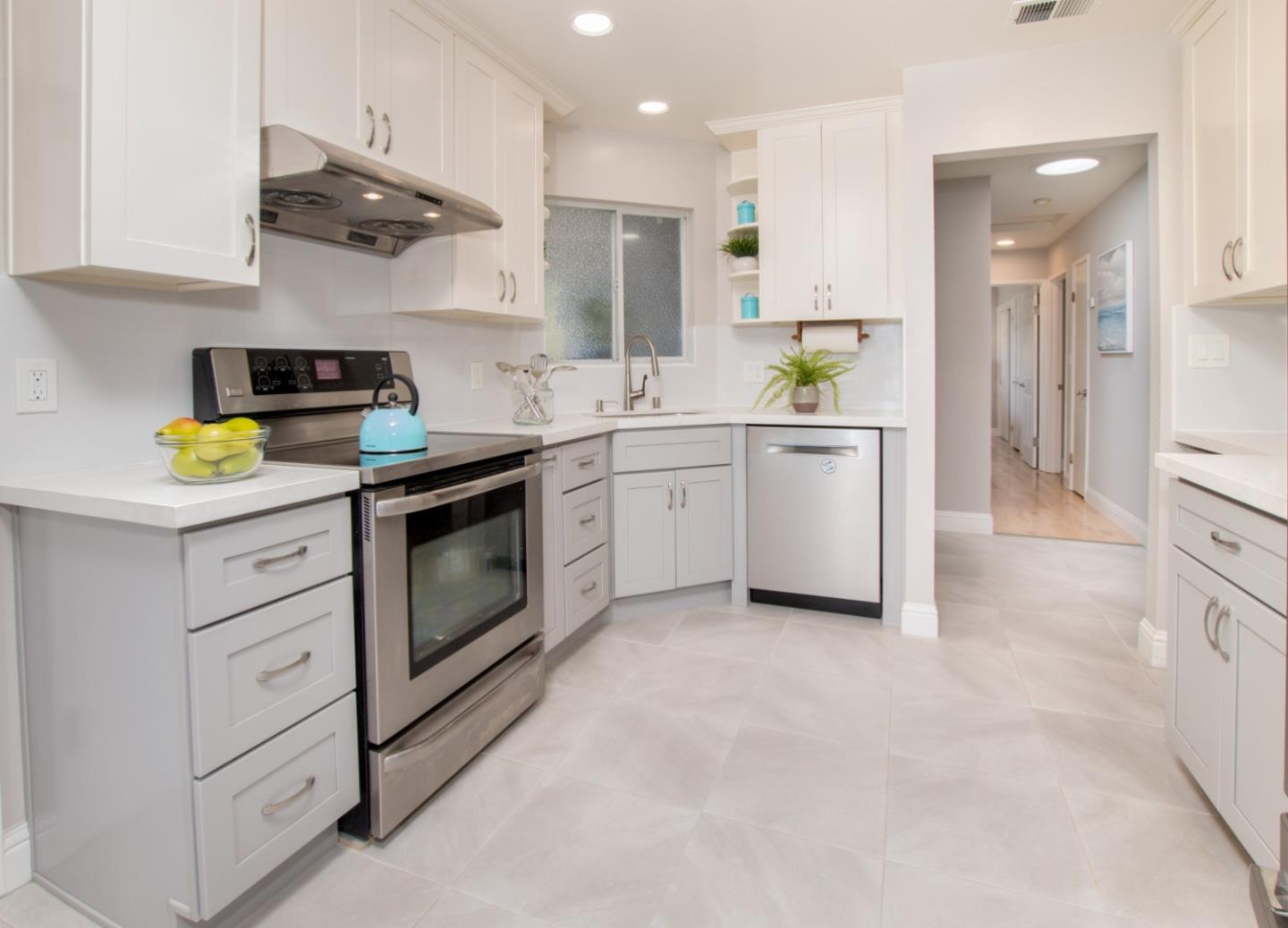 3416 Tracy Drive Santa Clara, CA 95051 - Photo 10 of 26 a kitchen with white cabinets and appliances