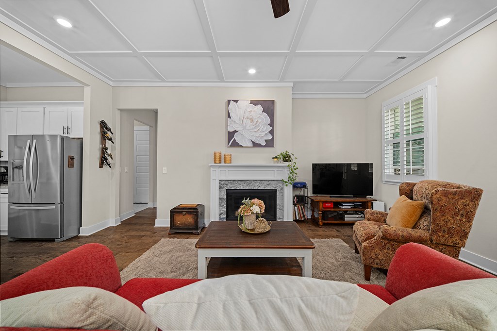 392 London Road Ball Ground, GA 30107 - Photo 12 of 60 a living room with furniture and a fireplace
