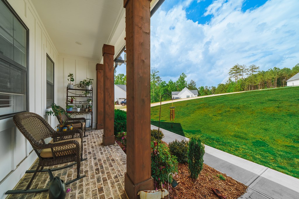 392 London Road Ball Ground, GA 30107 - Photo 3 of 60 a view of a patio with chair and table