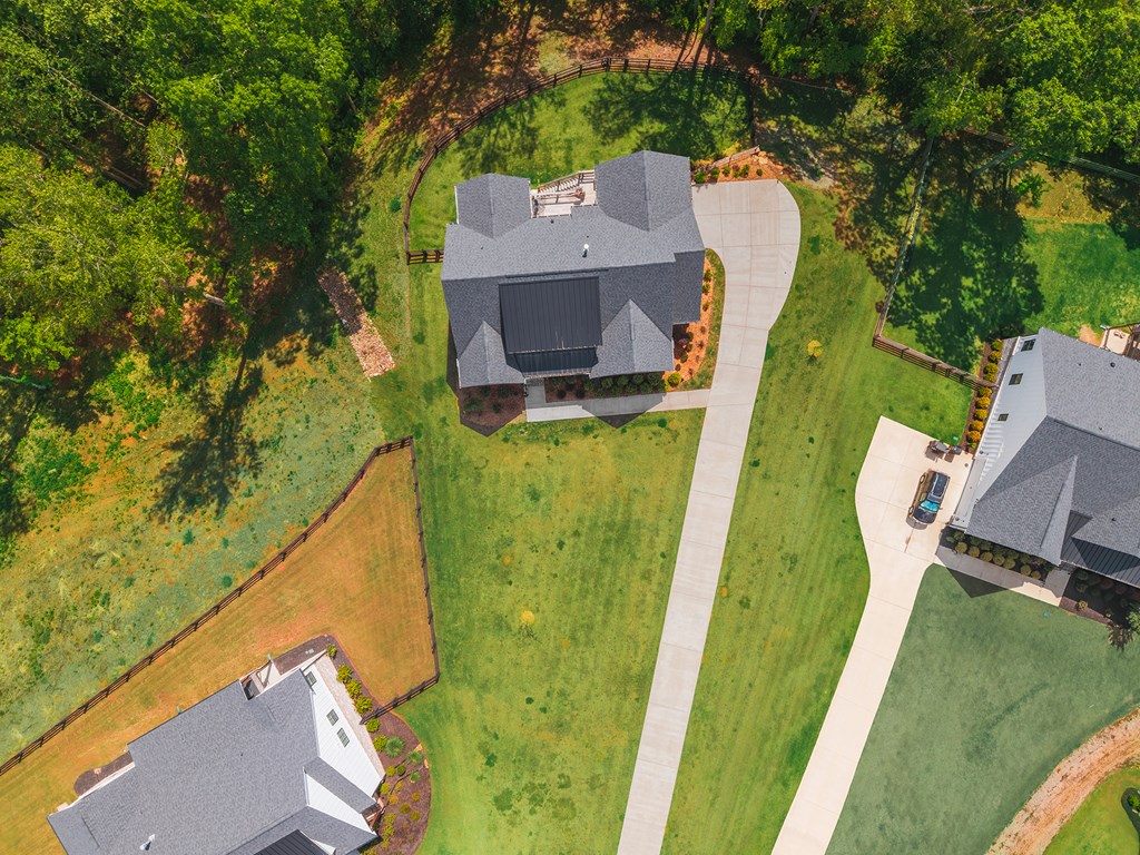 392 London Road Ball Ground, GA 30107 - Photo 36 of 60 an aerial view of a house with a garden and trees
