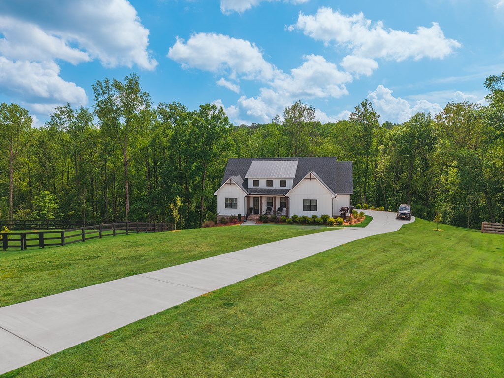 392 London Road Ball Ground, GA 30107 - Photo 51 of 60 a aerial view of a house with yard and green space