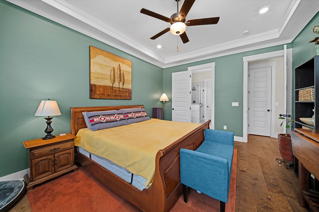 392 London Road Ball Ground, GA 30107 - Photo 6 of 60 a bedroom with a bed and wooden floor