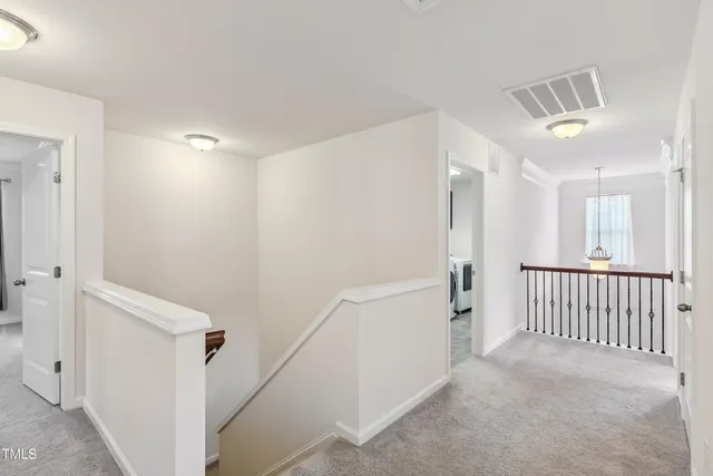 a view of a hallway with closet and entryway