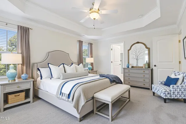 a bedroom with bed and a chandelier