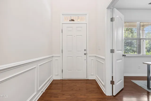 a view of an entryway with wooden floor