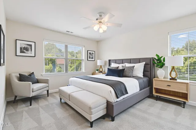 a spacious bedroom with a bed and a couch