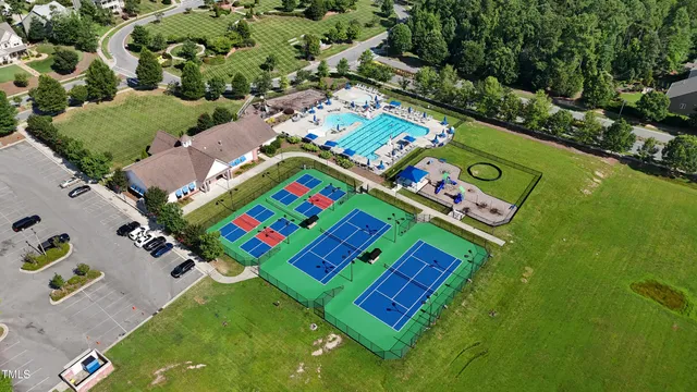 an aerial view of a pool patio yard and outdoor seating