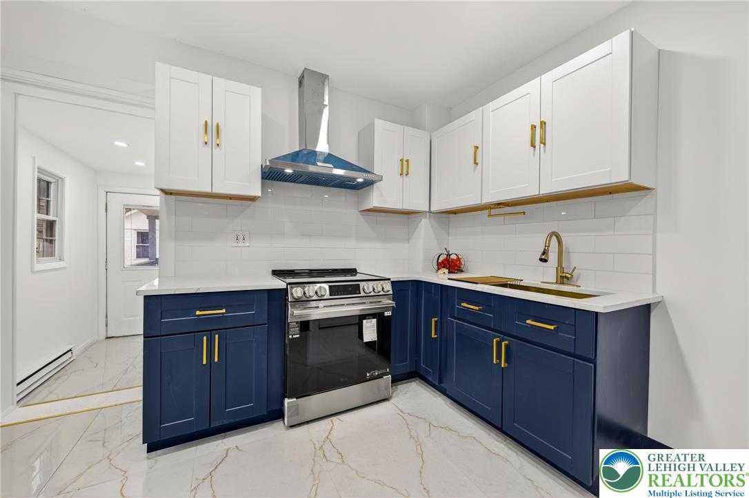 43 Evergreen Street Nazareth, PA 18064 - Photo 12 of 39 a kitchen with stainless steel appliances granite countertop a sink dishwasher stove and cabinets