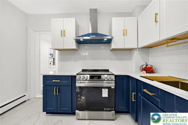 a kitchen with stainless steel appliances granite countertop a stove and a cabinets