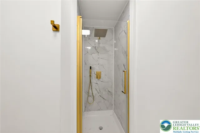 a bathroom with a glass shower door
