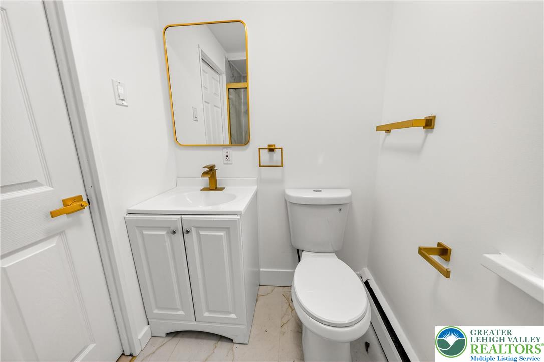 43 Evergreen Street Nazareth, PA 18064 - Photo 28 of 39 a white toilet sitting next to a bathroom sink