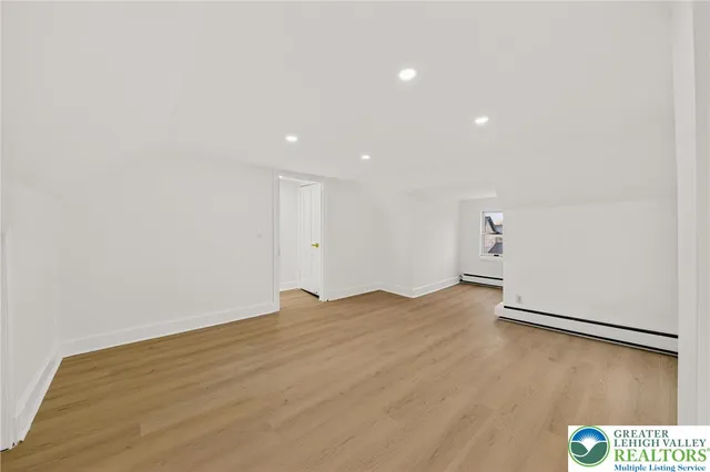 a view of a porch with wooden floor