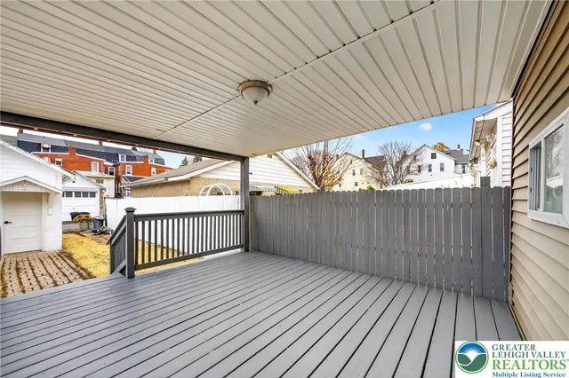 a view of a balcony with wooden floor