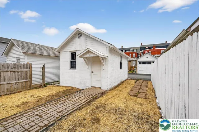 a view of a house with a street