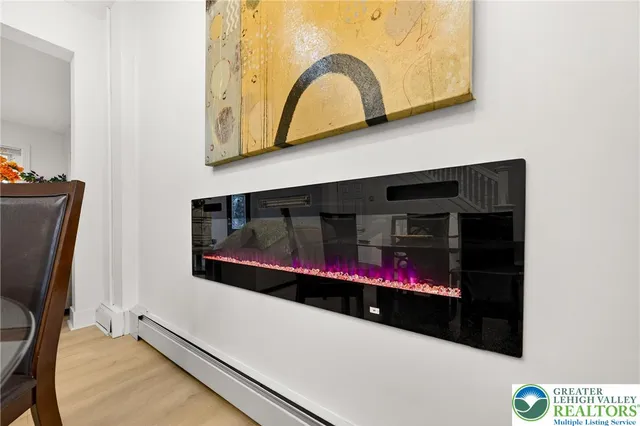 a living room with washer and a flat screen tv