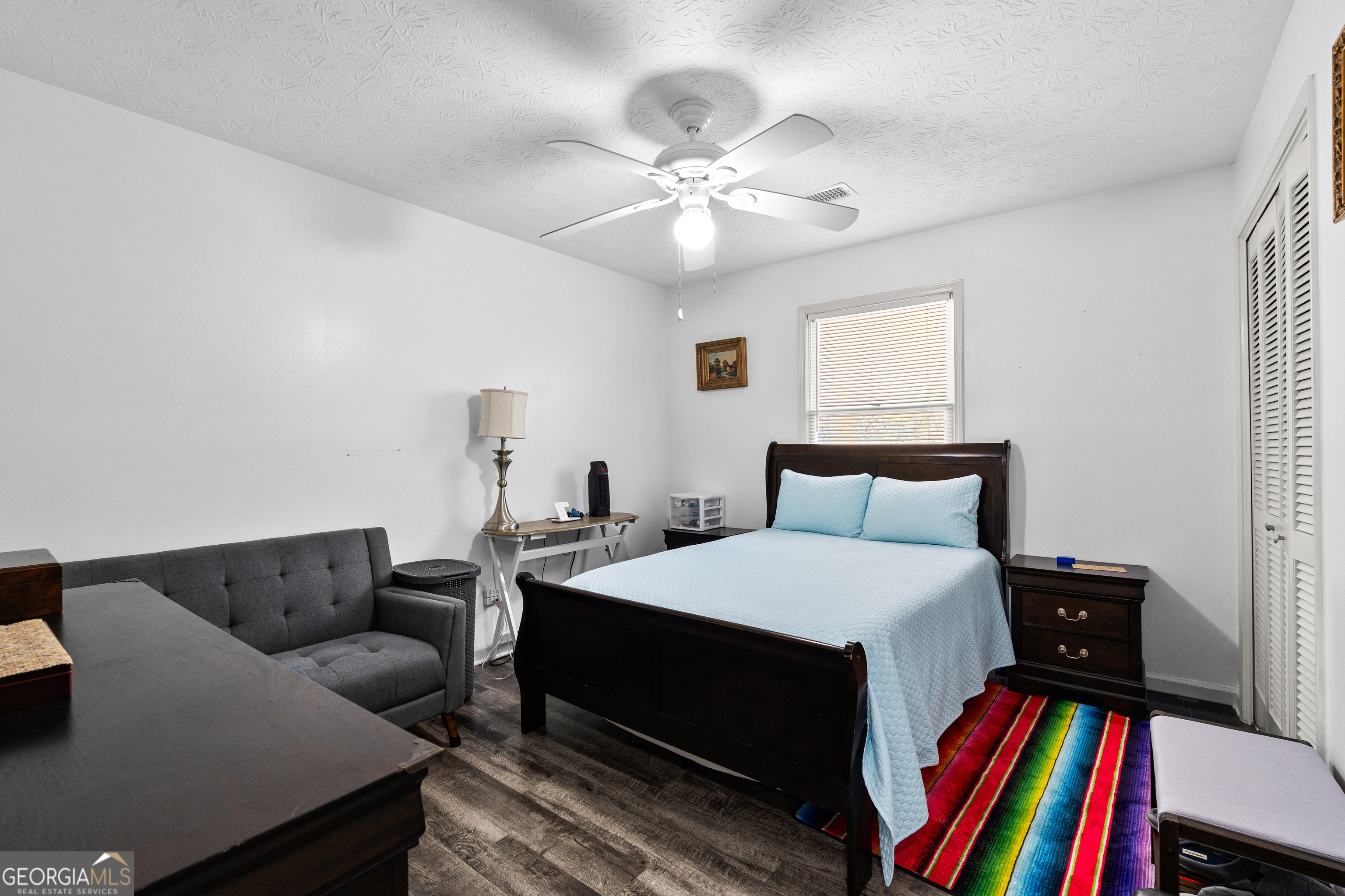 230 Ridge Road Tyrone, GA 30290 - Photo 27 of 47 a bedroom with a bed and a bookshelf