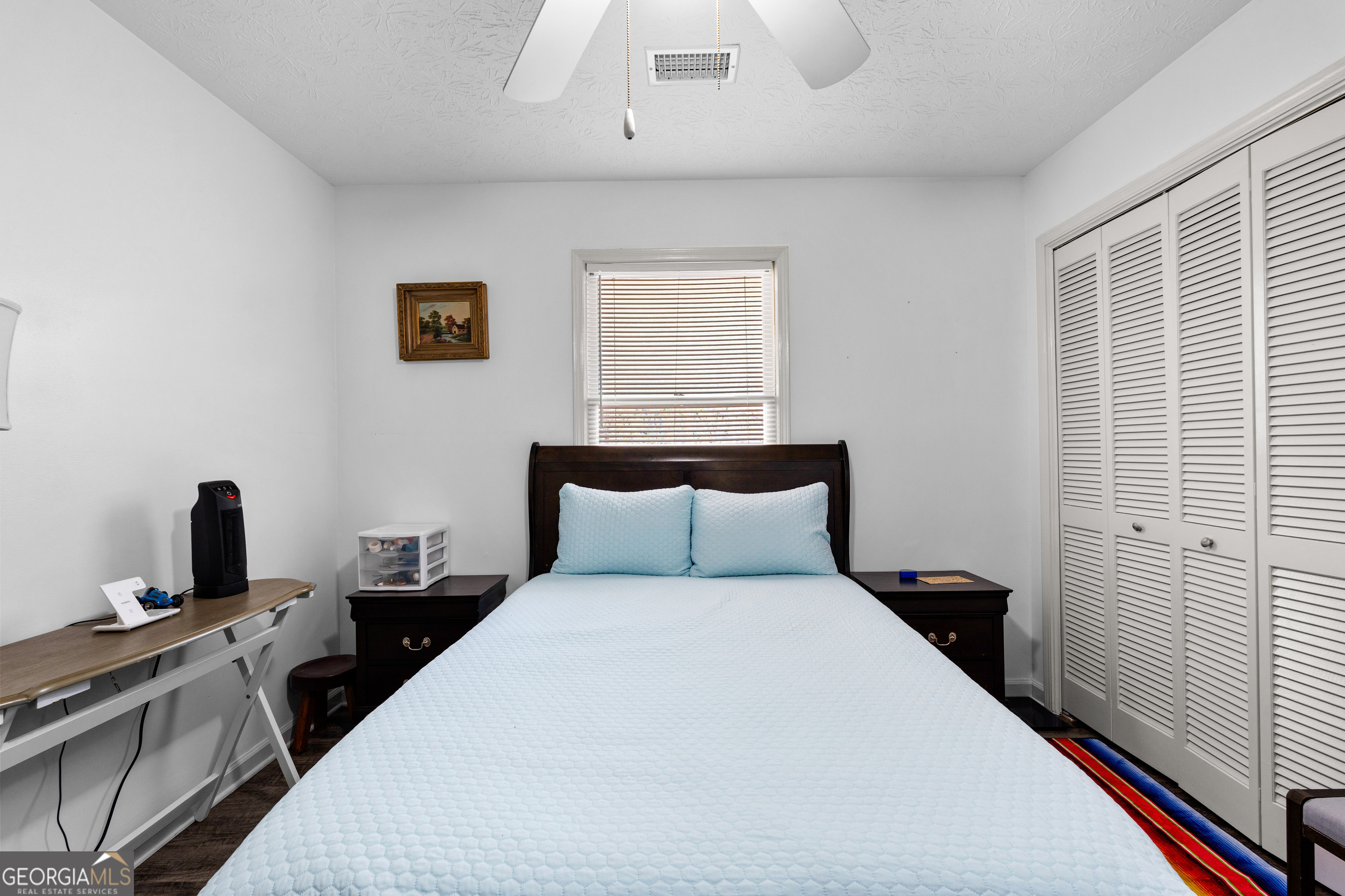 230 Ridge Road Tyrone, GA 30290 - Photo 28 of 47 a bedroom with a bed and a tv