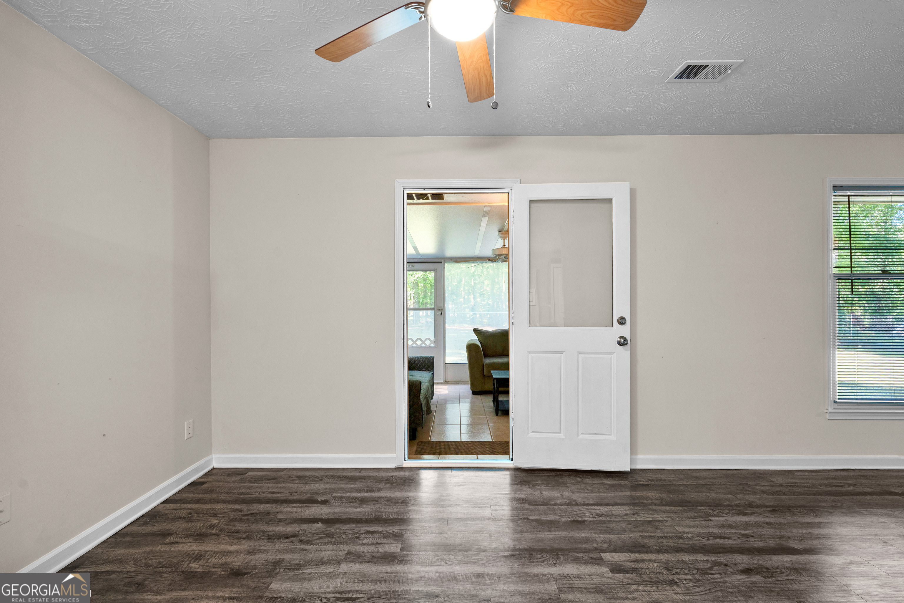 230 Ridge Road Tyrone, GA 30290 - Photo 30 of 47 an empty room with wooden floor and windows