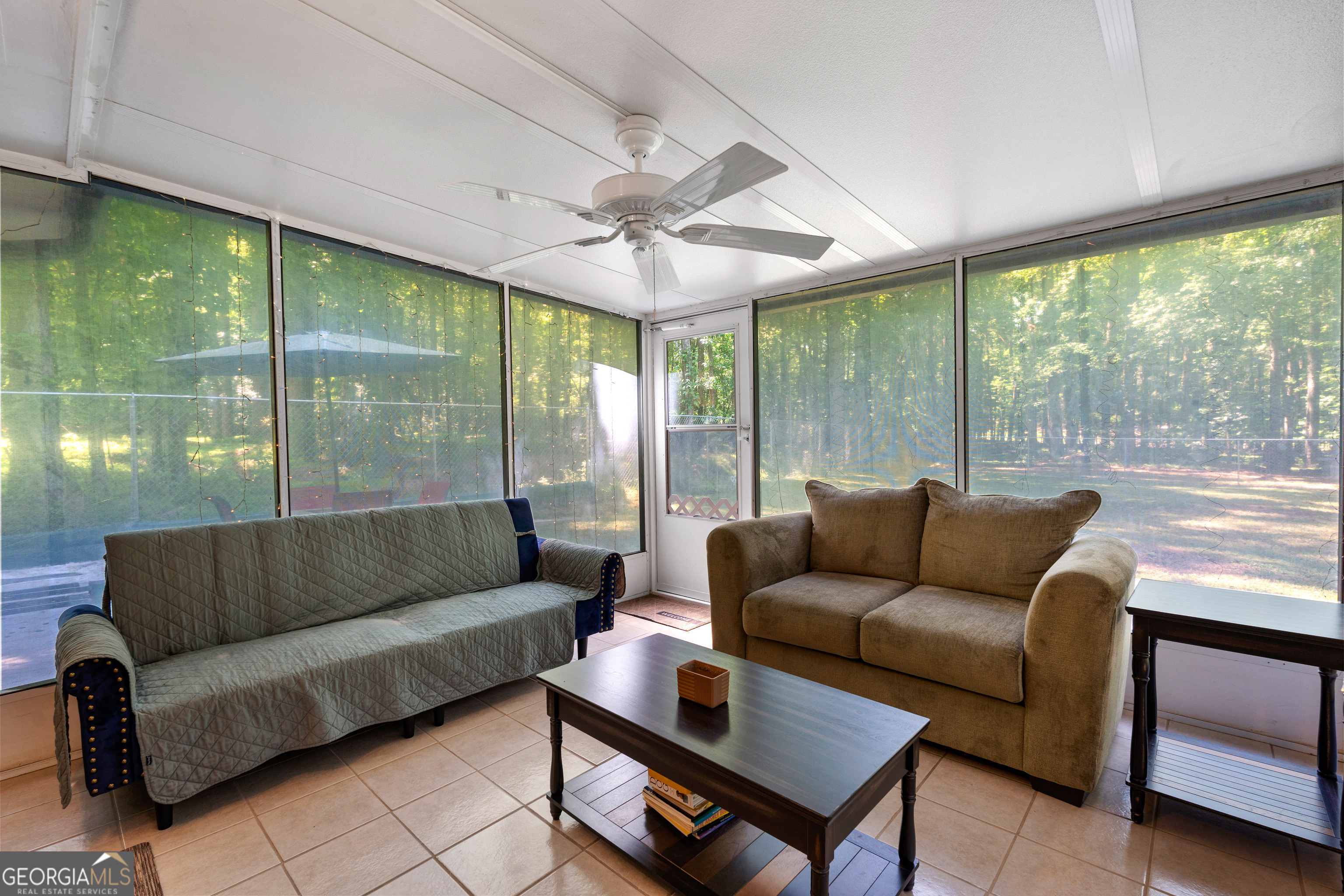 230 Ridge Road Tyrone, GA 30290 - Photo 32 of 47 a living room with furniture and a large window