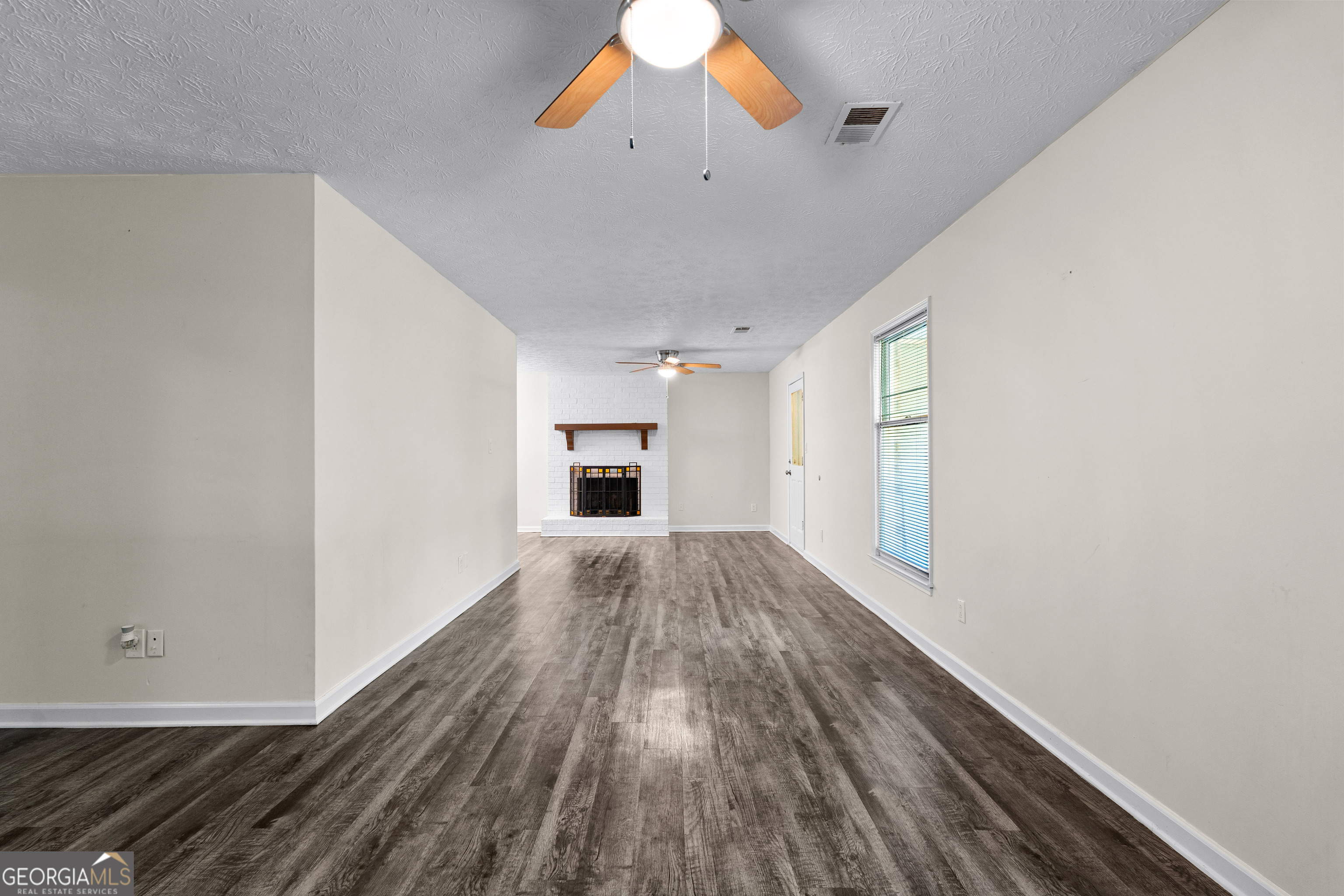 230 Ridge Road Tyrone, GA 30290 - Photo 8 of 47 a view of empty room with wooden floor