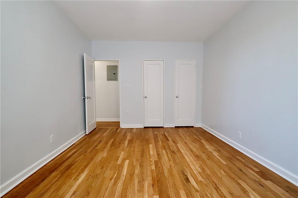 3025 Ocean Avenue, Unit 6E Brooklyn, NY 11235 - Photo 14 of 18 a view of an empty room with wooden floor