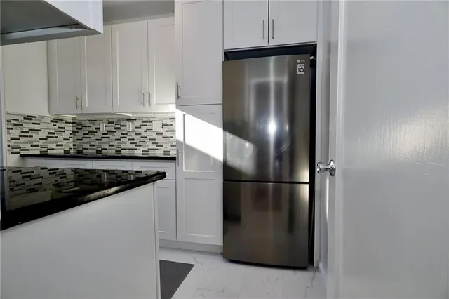 a kitchen with a stove and a microwave