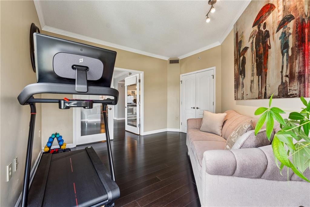 3475 Oak Valley Road Northeast, Unit 980 Atlanta, GA 30326 - Photo 16 of 42 a living room with furniture and wooden floor