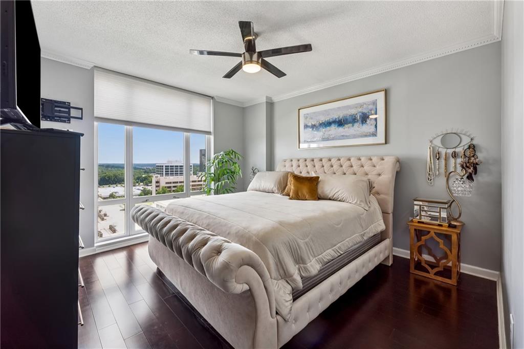 3475 Oak Valley Road Northeast, Unit 980 Atlanta, GA 30326 - Photo 19 of 42 a bed room with a bed and a window