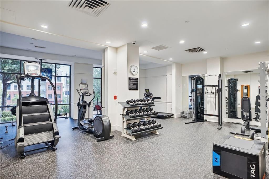 3475 Oak Valley Road Northeast, Unit 980 Atlanta, GA 30326 - Photo 29 of 42 a view of a room with gym equipment