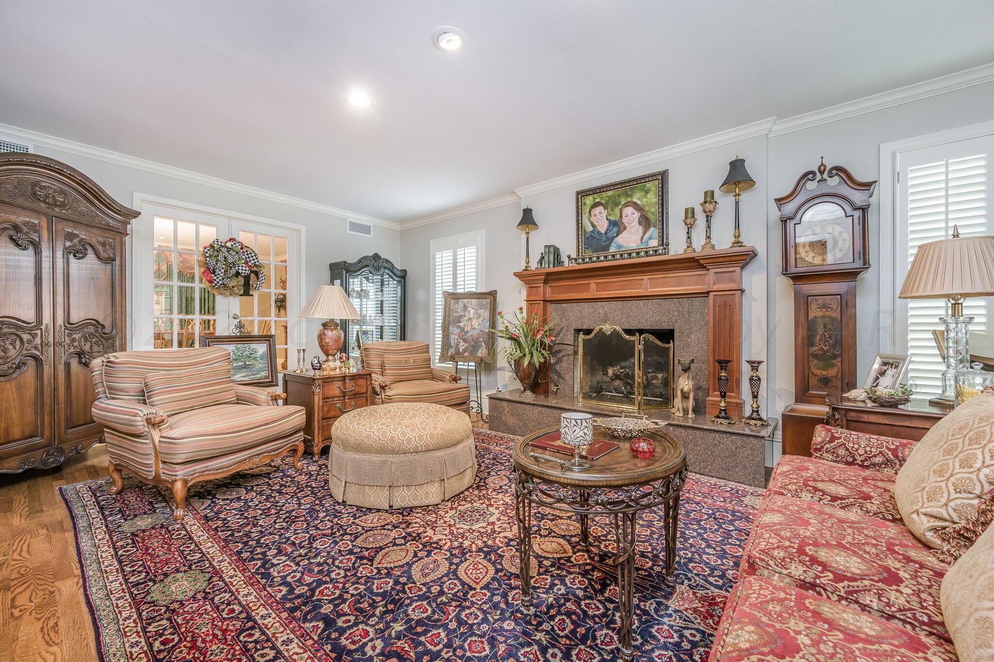 3518 Danbury Drive Amarillo, TX 79109 - Photo 18 of 59 a living room with furniture and a fireplace