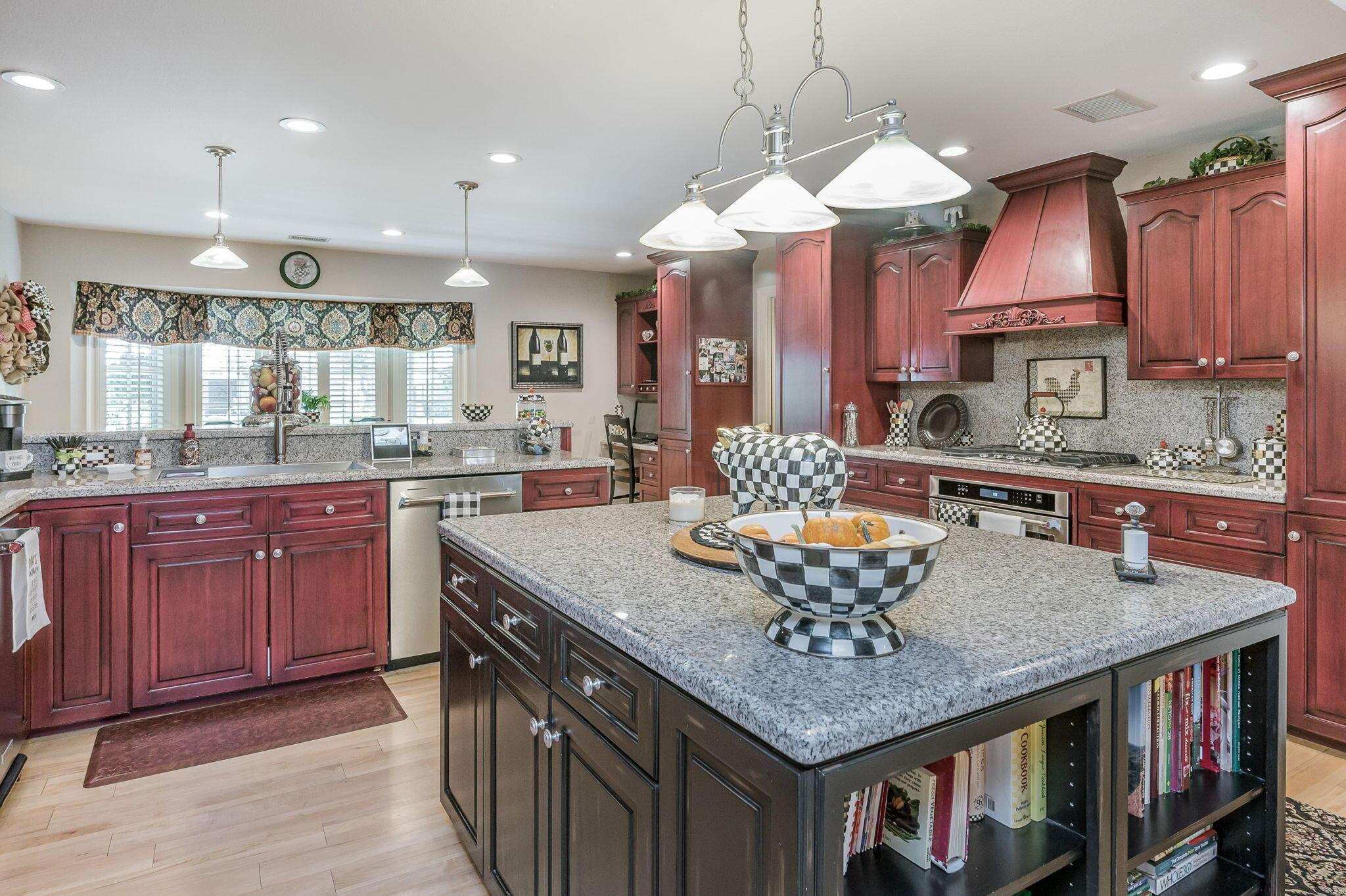 3518 Danbury Drive Amarillo, TX 79109 - Photo 3 of 59 a kitchen with granite countertop stainless steel appliances a sink and a white cabinets