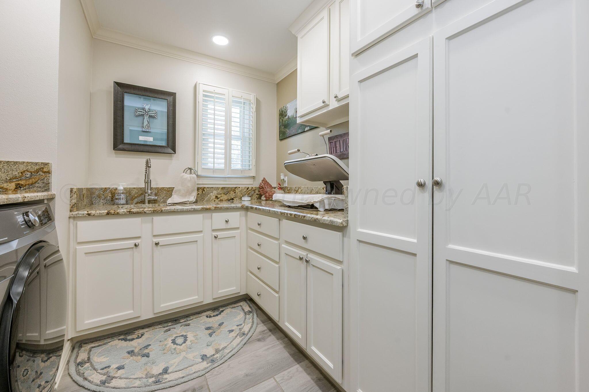 3518 Danbury Drive Amarillo, TX 79109 - Photo 32 of 59 a kitchen with a sink cabinets and appliances