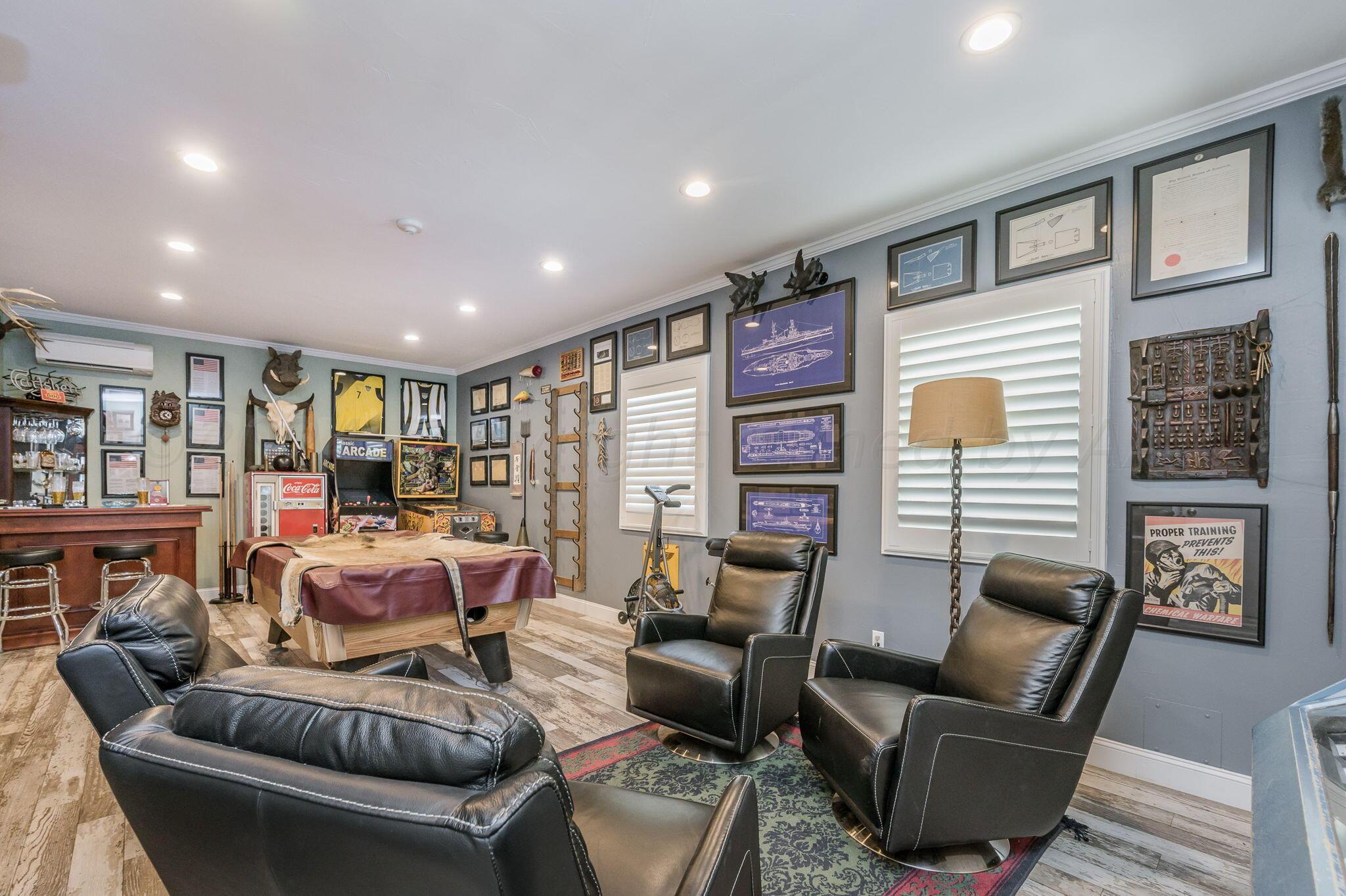 3518 Danbury Drive Amarillo, TX 79109 - Photo 39 of 59 a living room with furniture and a bookshelf