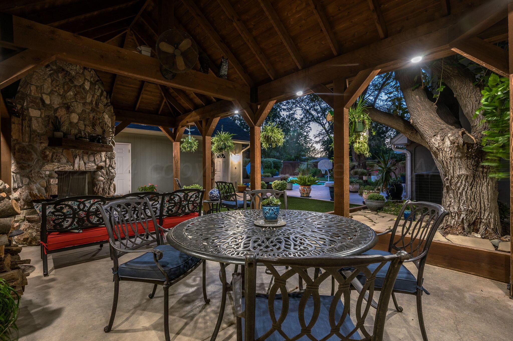 3518 Danbury Drive Amarillo, TX 79109 - Photo 43 of 59 a view of an outdoor dining space with a table and chairs