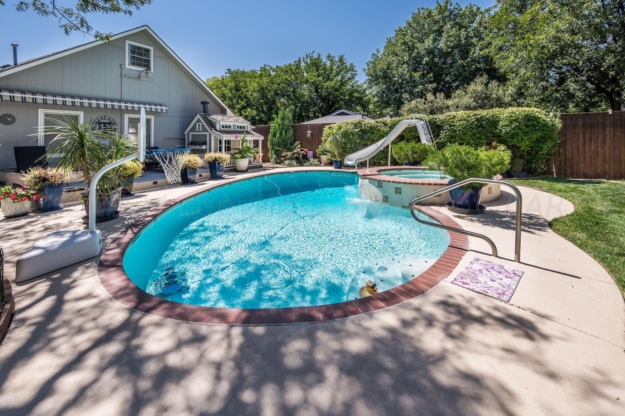 3518 Danbury Drive Amarillo, TX 79109 - Photo 48 of 59 a view of a swimming pool with a lounge chairs
