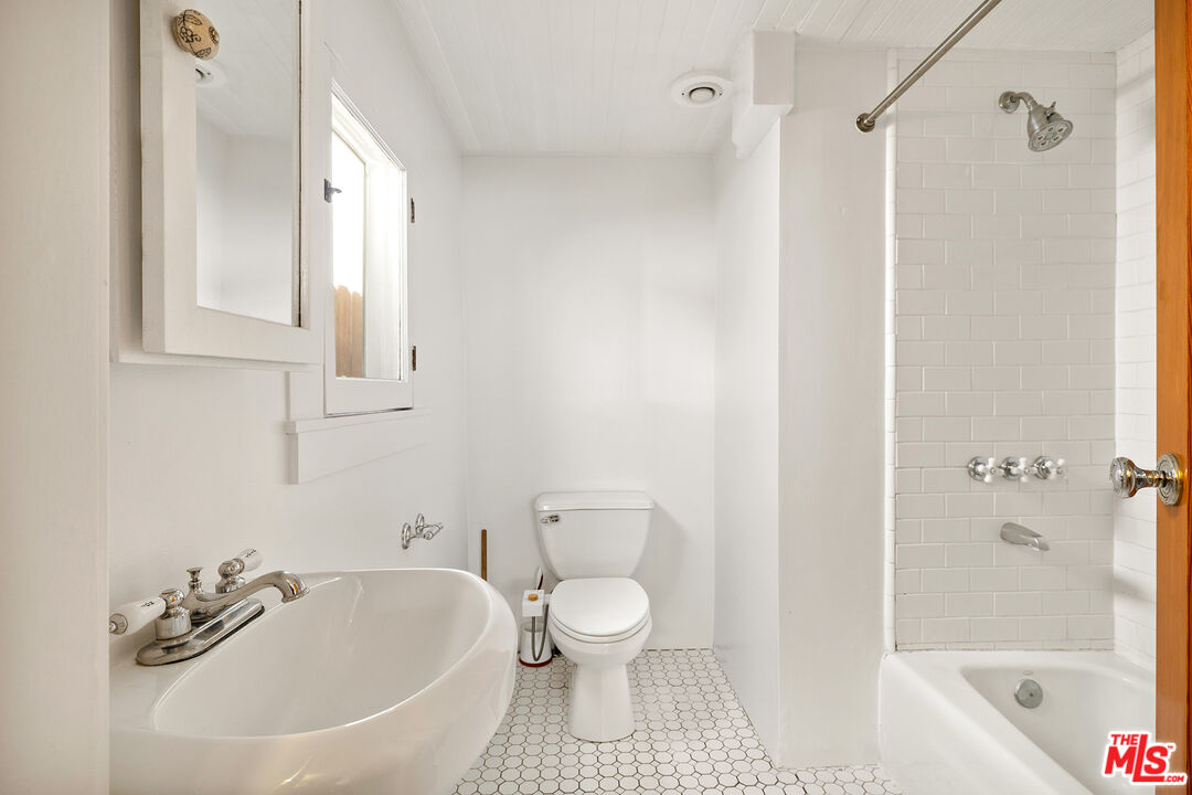 2105 Echo Park Avenue Los Angeles, CA 90026 - Photo 11 of 31 a bathroom with a toilet and a bathtub