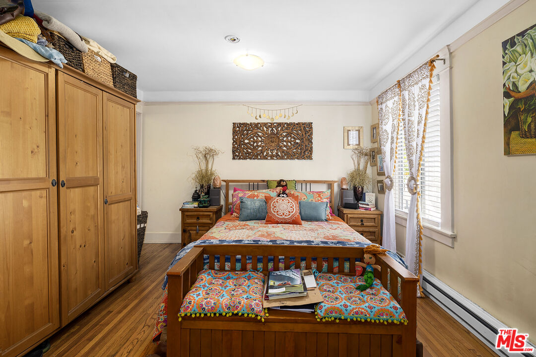 2105 Echo Park Avenue Los Angeles, CA 90026 - Photo 16 of 31 a bedroom with a bed next to a window