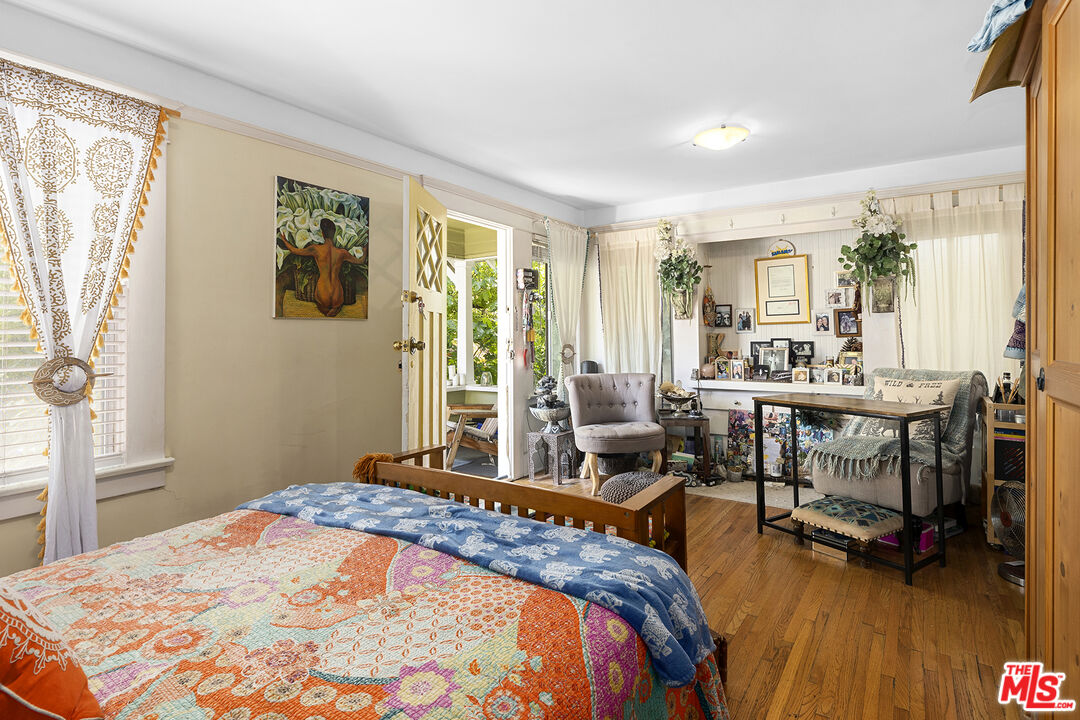 2105 Echo Park Avenue Los Angeles, CA 90026 - Photo 18 of 31 a bedroom with a bed and wooden floor