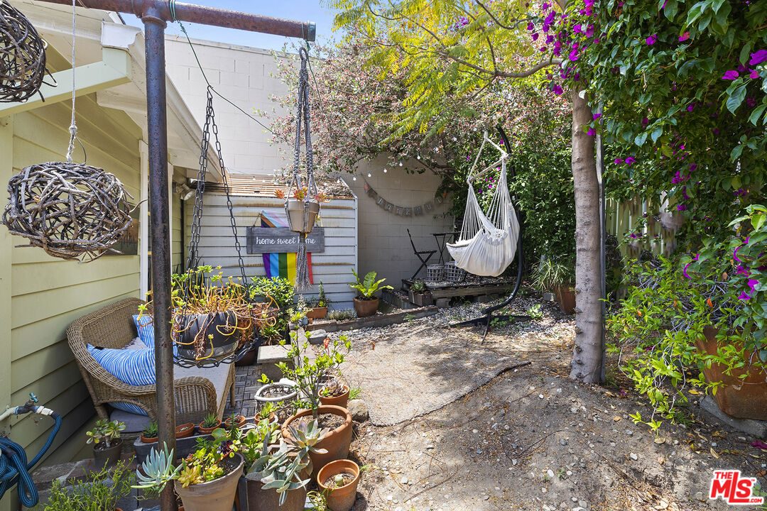 2105 Echo Park Avenue Los Angeles, CA 90026 - Photo 20 of 31 a backyard of a house with lots of green space and fountain
