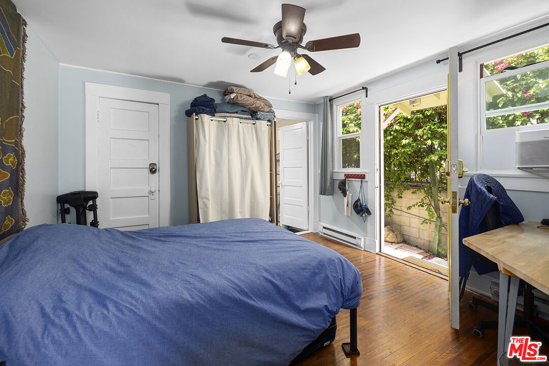2105 Echo Park Avenue Los Angeles, CA 90026 - Photo 21 of 31 a bedroom with a bed and a large window with the outer view