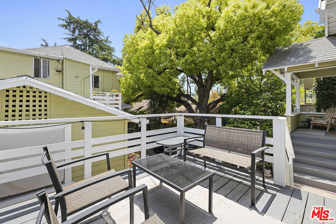 2105 Echo Park Avenue Los Angeles, CA 90026 - Photo 24 of 31 a balcony with a table and chairs