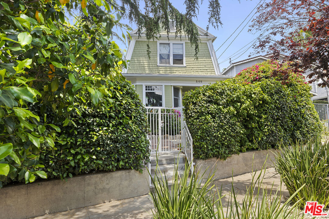 2105 Echo Park Avenue Los Angeles, CA 90026 - Photo 3 of 31 a front view of a house with a garden