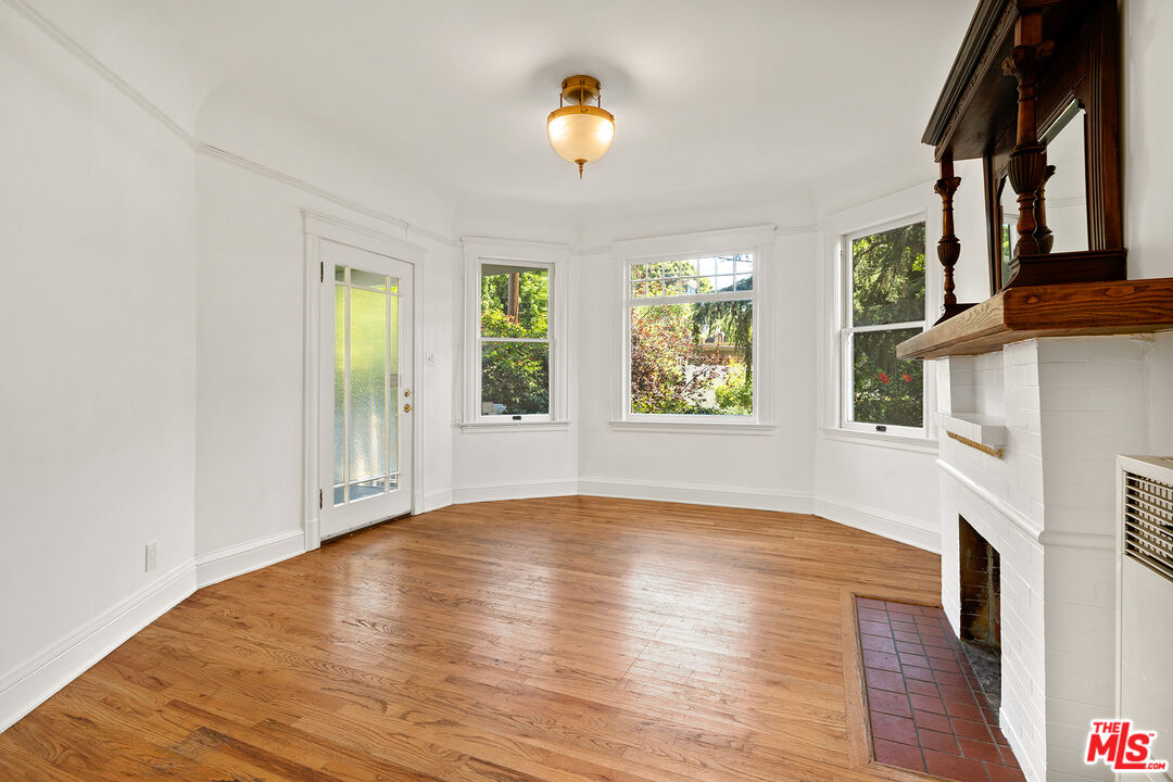 2105 Echo Park Avenue Los Angeles, CA 90026 - Photo 6 of 31 a view of an empty room with wooden floor and a window