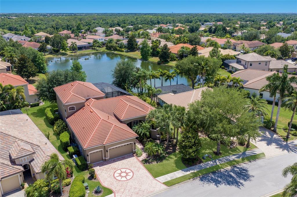 14806 Bowfin Terrace Lakewood Ranch, FL 34202 - Photo 1 of 58 an aerial view of a houses with a lake view