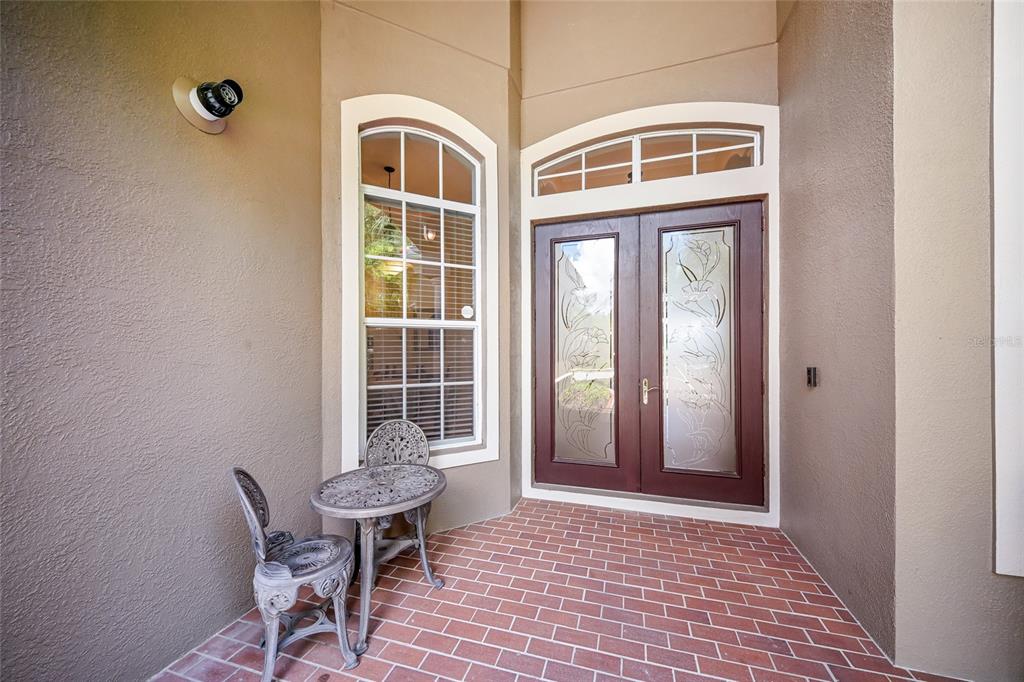 14806 Bowfin Terrace Lakewood Ranch, FL 34202 - Photo 11 of 58 a view of a room with a large window and chair