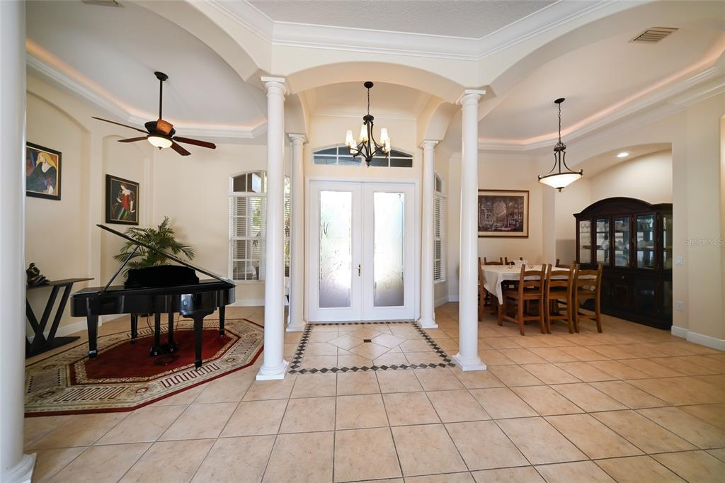 14806 Bowfin Terrace Lakewood Ranch, FL 34202 - Photo 12 of 58 a view of a lobby with furniture and a chandelier